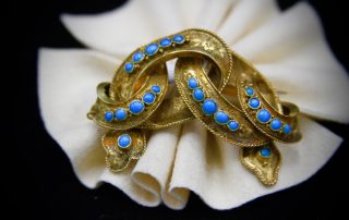 A gold ring with blue gems.