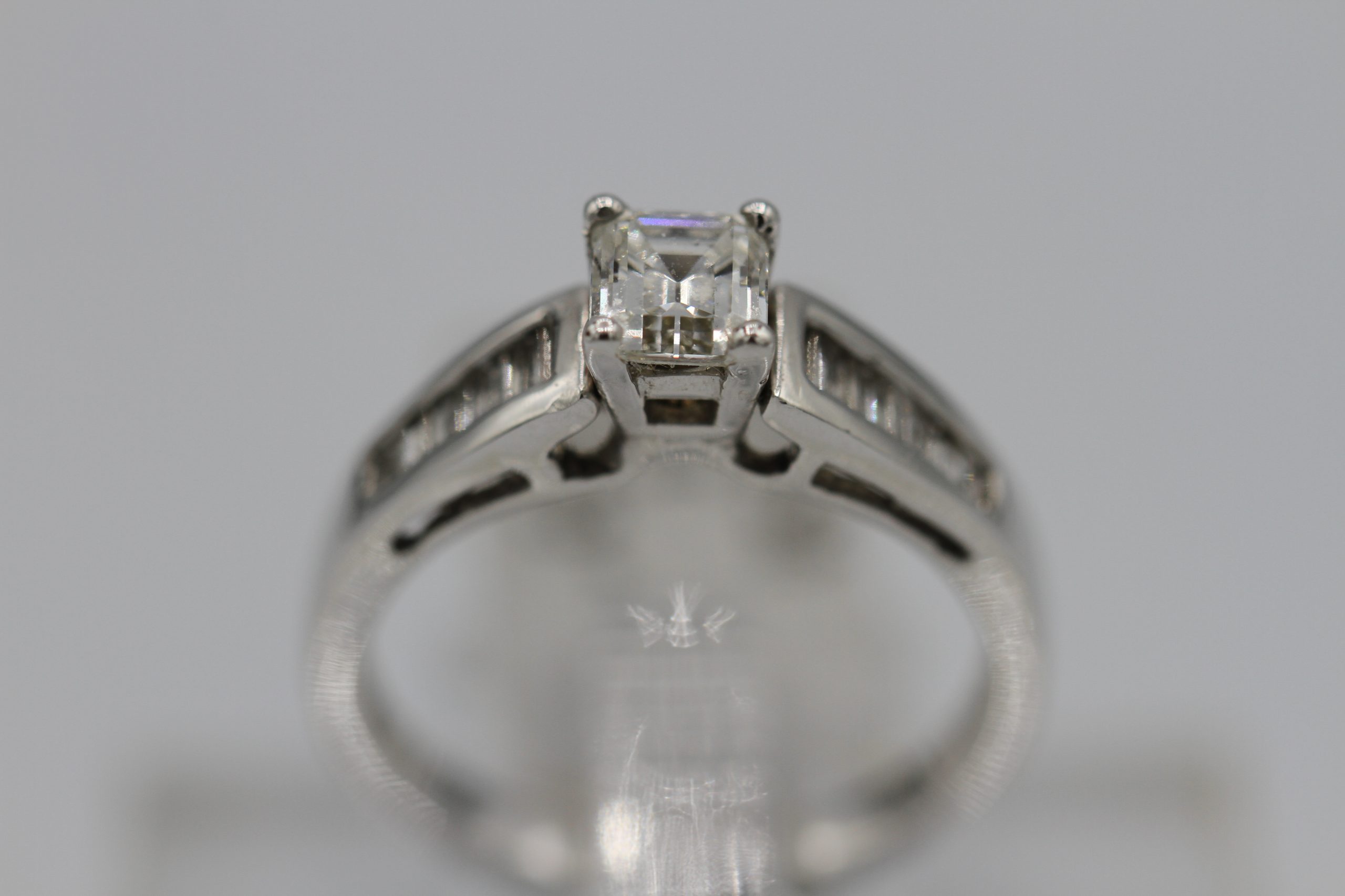 A silver ring with diamond centerpiece