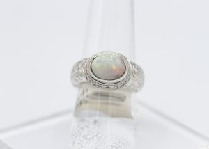 A ring with a large, multi-color gemstone