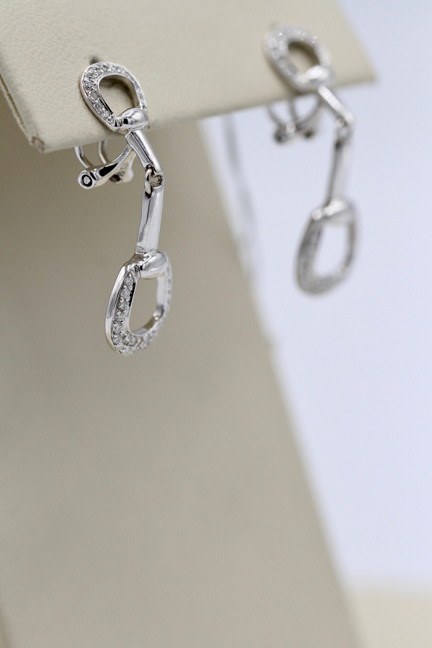 Silver earrings in the shape of horseshoes