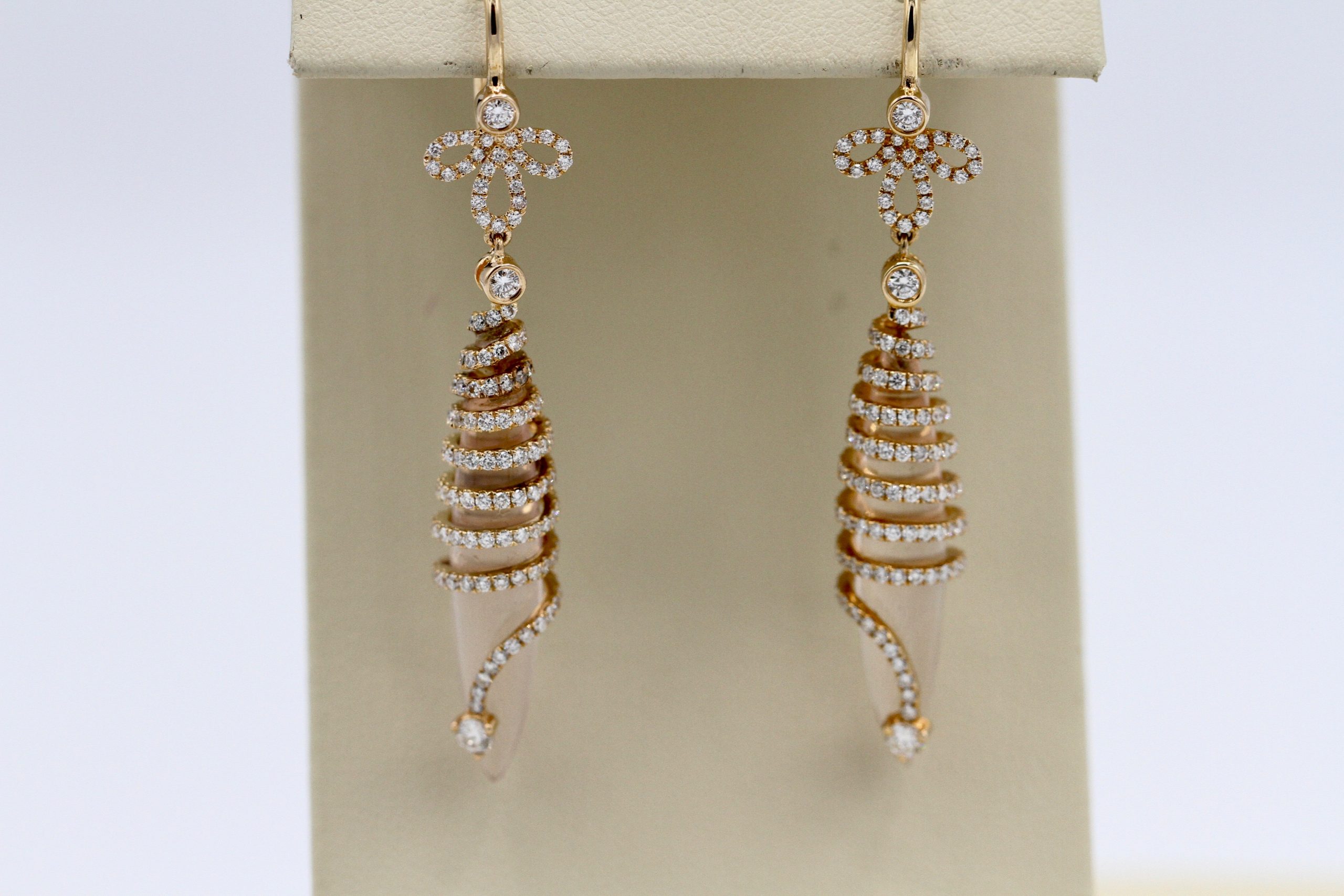 Spiral earrings with inlaid diamond