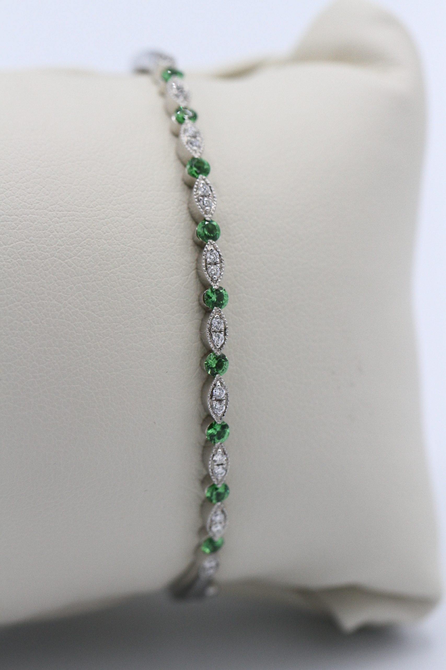 A small diamond and emerald bracelet
