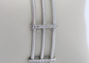 A thin silver and diamond bracelet