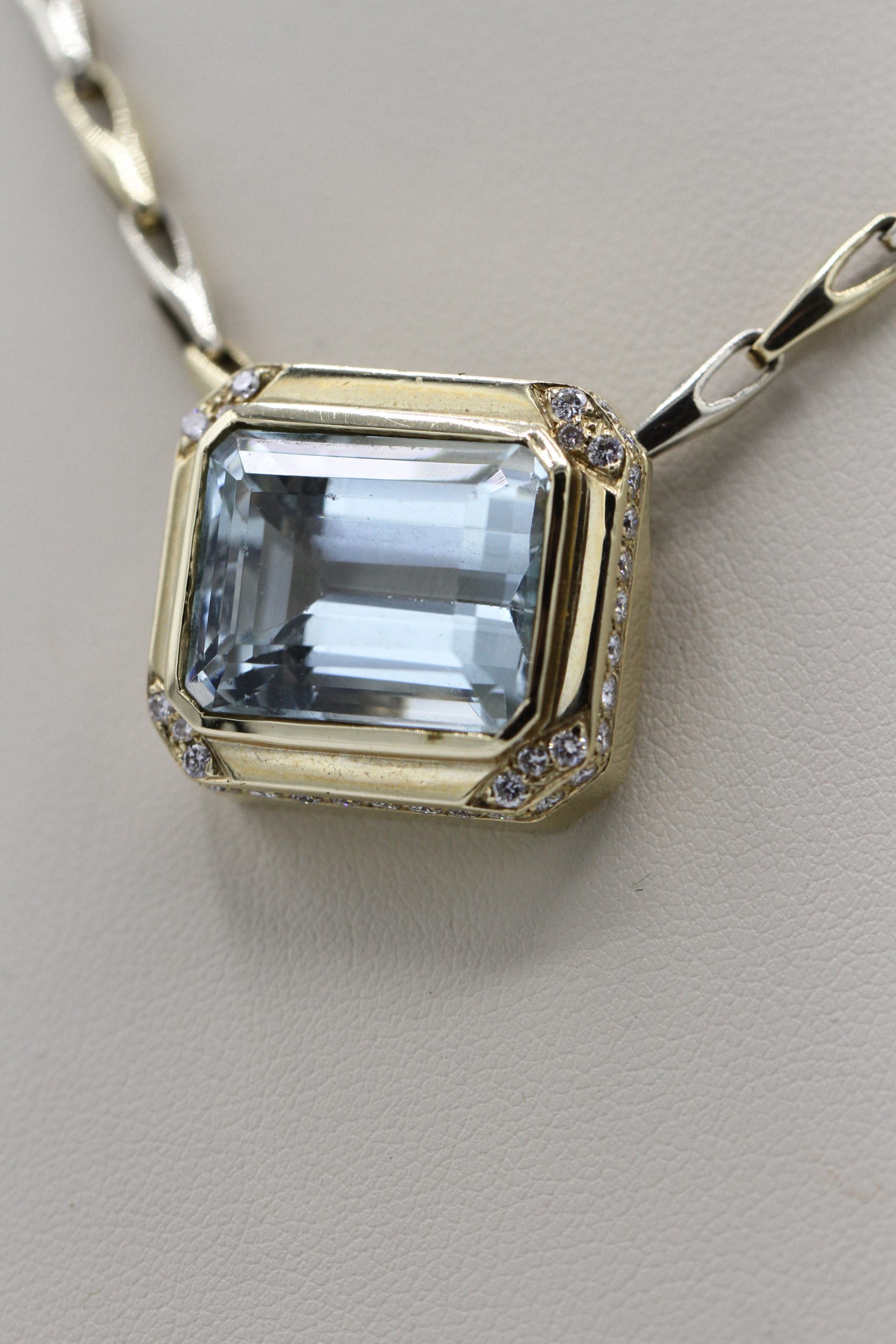 A necklace with a large, square large centerpiece