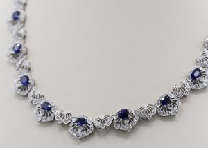 An ornate necklace with diamonds and saphire