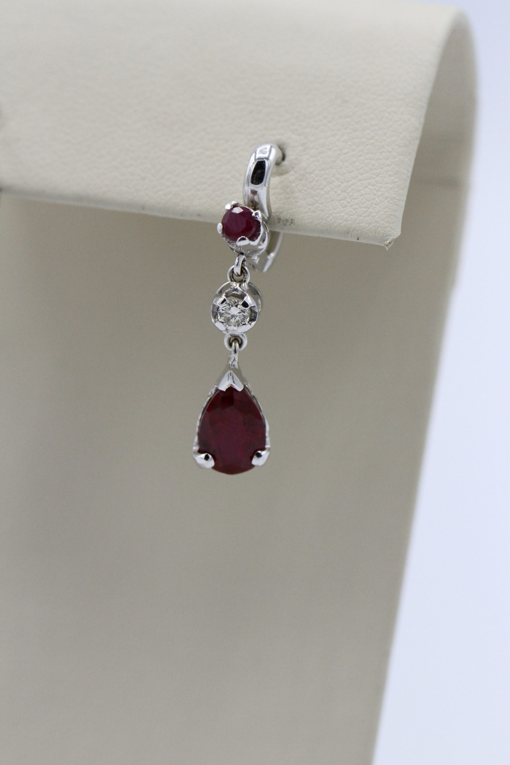 Earrings with a red stone