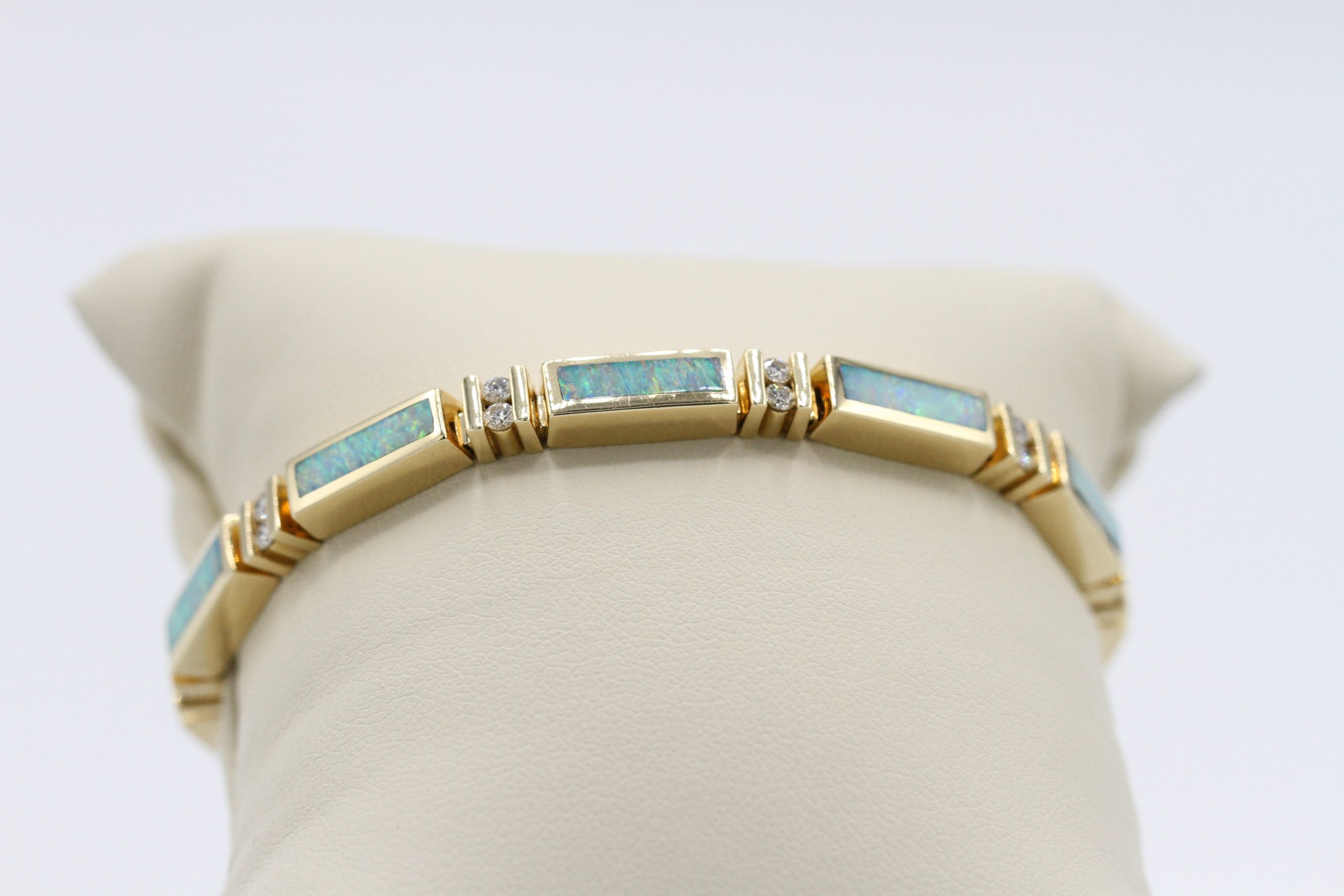 A gold bracelet with inlaid diamonds