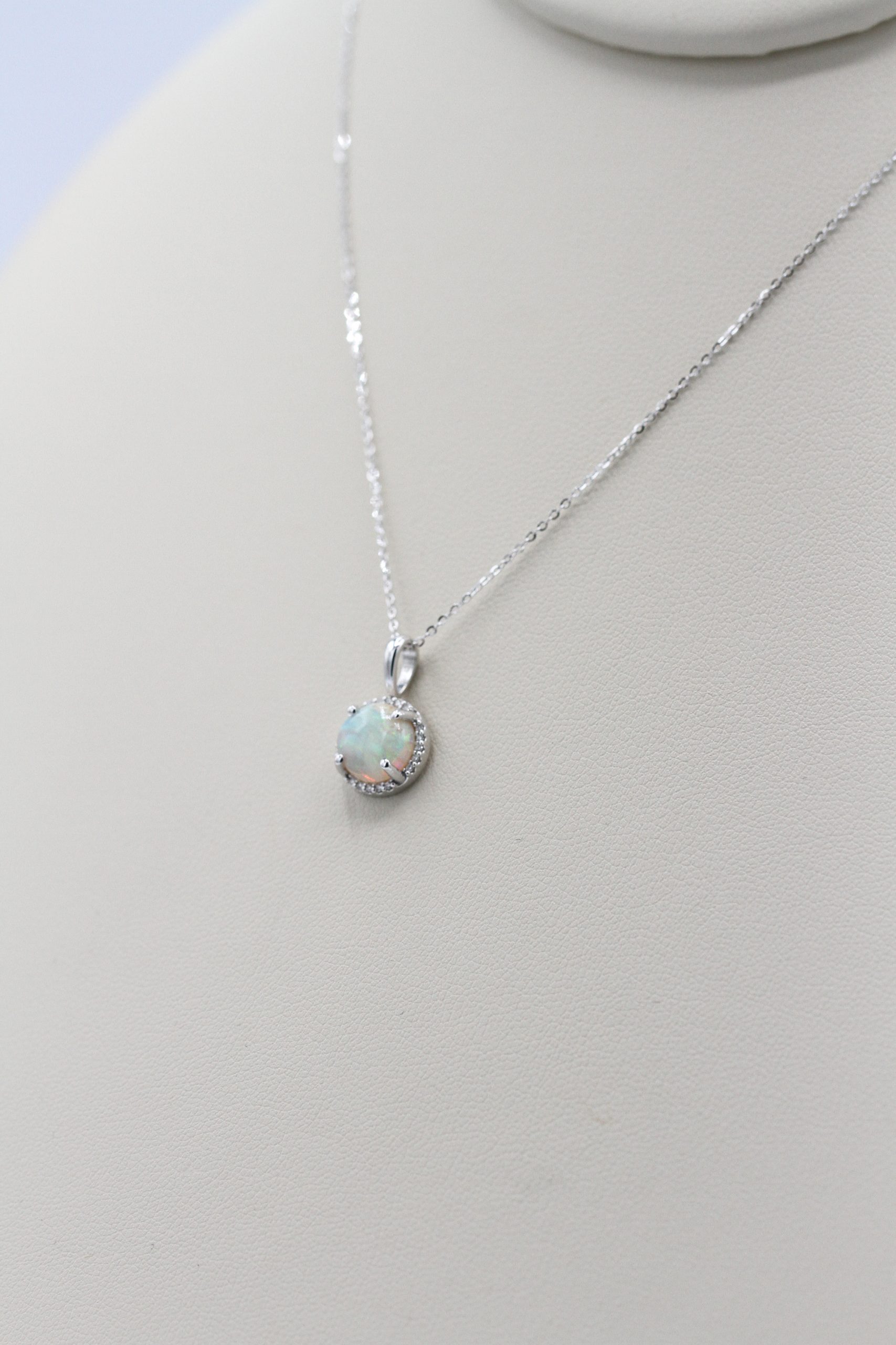 A necklace with a round shaped gemstone
