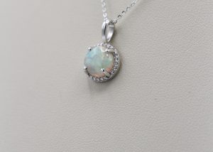A necklace with a round shaped gemstone